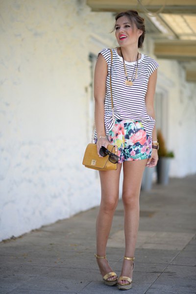 sleeveless black and white striped tank top with mini shorts with a floral pattern