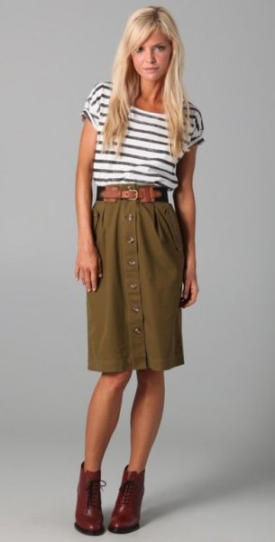 black and white striped T-shirt with a high waisted olive green knee-length skirt
