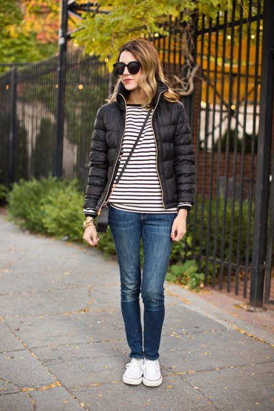 black and white striped t-shirt with a bubble jacket and sneakers