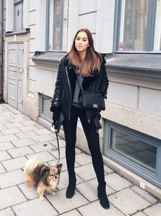 black aviator jacket with gray knitted sweater and skinny jeans