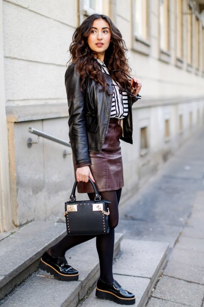 black biker jacket with leather skirt and slippers