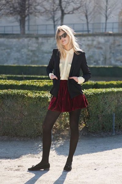 black blazer with burgundy-colored minirater skirt and velvet flats