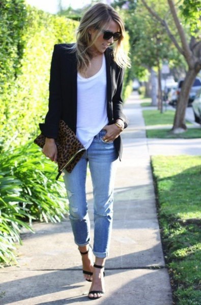black blazer with white tank top and light blue jeans with cuffs