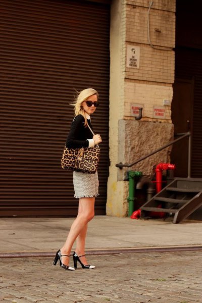 black leopard print blouse with wallet and pink mini skirt