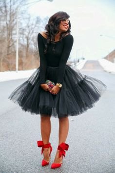 black long-sleeved top with boat neckline and mini tutu dress