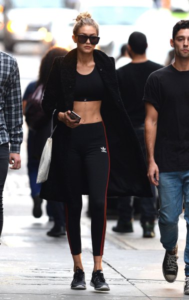 black bomber jacket with crop top and sports leggings