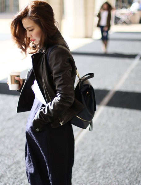 black bomber jacket with dark blue midi dress with backpack wallet