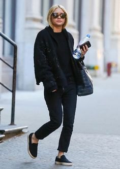 black bomber jacket with slim-fit jeans and slip-on shoes made of canvas