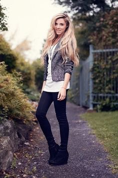 black boots with a heather gray blazer and long white t-shirt