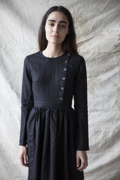 airy dress made of linen with a black button on the front
