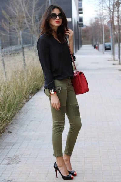 black shirt with buttons and green skinny jeans