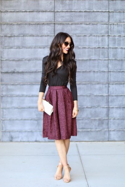 black shirt with buttons and pleated midi skirt made of wool