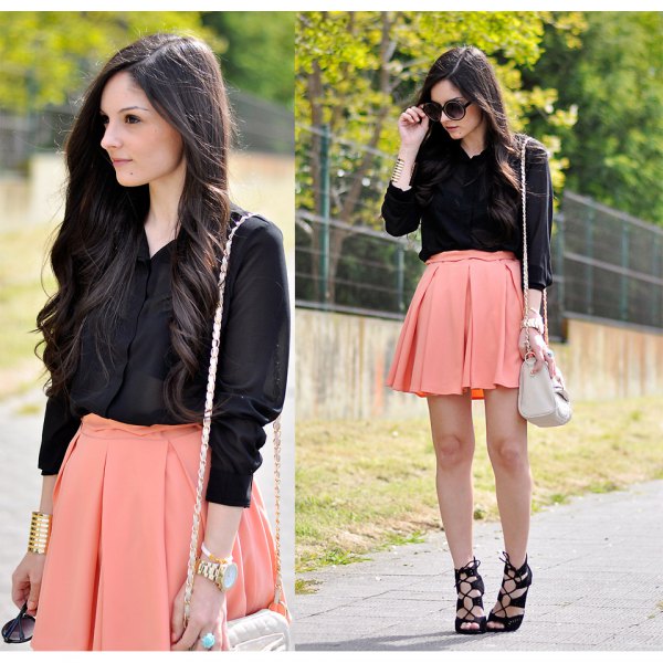 black shirt with buttons and light orange minirater skirt