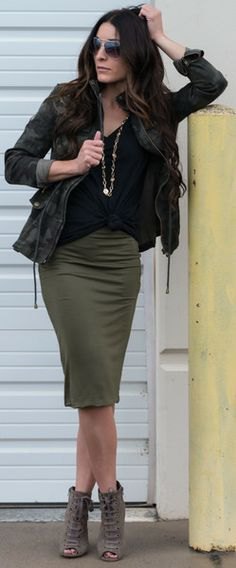 black camouflage jacket with olive green knee-length skirt