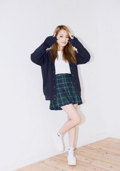 black cardigan with checkered minirater skirt and sneakers