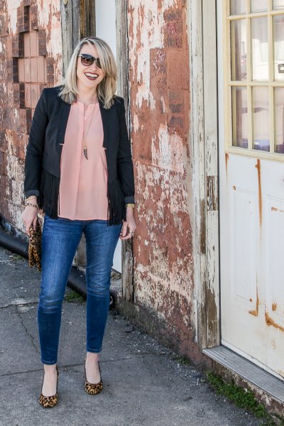 black casual blazer with a blushing pink chiffon blouse and blue jeans