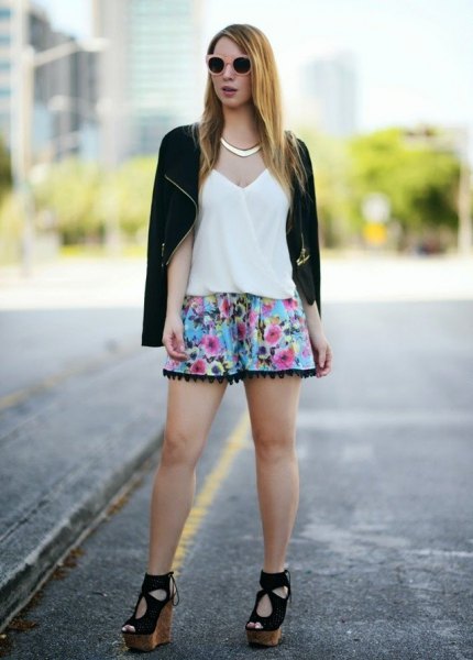 black casual blazer with light blue mini shorts with a floral pattern
