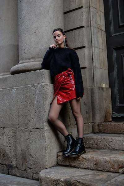 black coarse knit sweater, red leather wrap skirt