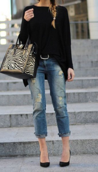 black, chunky sweater with cuffed jeans and ballerinas