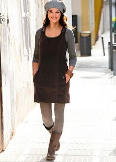 black corduroy mini dress with gray leggings and knee-high leather boots