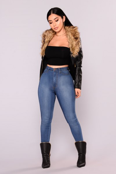black crop top with leather jacket and blue skinny jeans