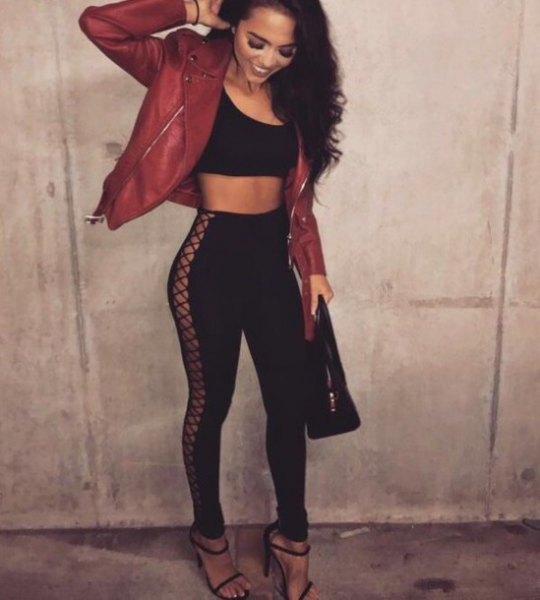 black crop top with red leather moto jacket and lace-up pants