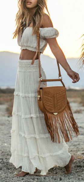 Black cut from the top of the shoulder with a high-waisted maxi gypsy skirt