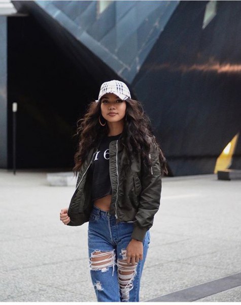 black short t-shirt with olive-green bomber jacket and torn boyfriend jeans