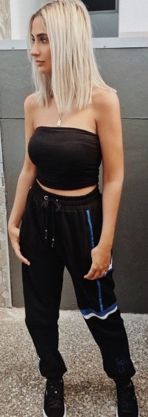 black, cropped tube top with sweatpants and sneakers with tapered legs