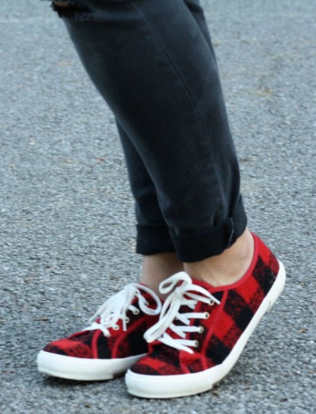 black jeans with cuff and red plaid plimsolls