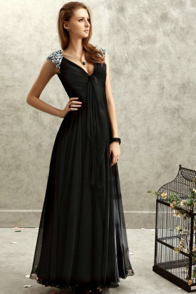 black deep chiffon dress with deep V-neckline, silver straps