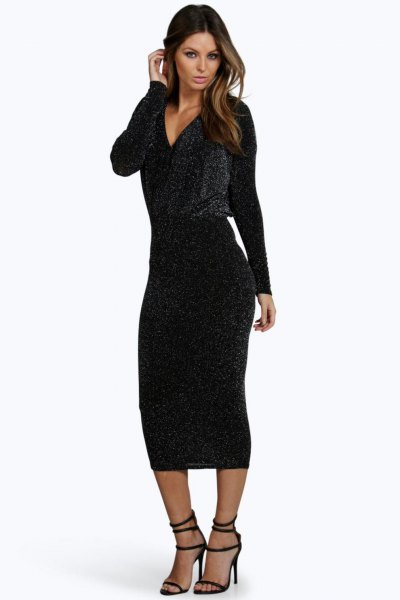 black, long-sleeved, figure-hugging midi dress with deep V-neckline and open toes