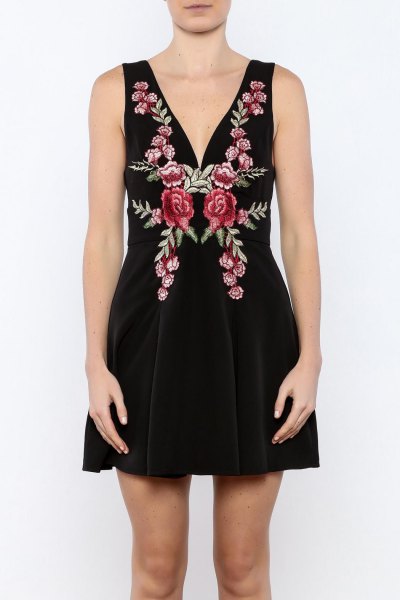 black, deeply embroidered mini dress with deep V-neckline
