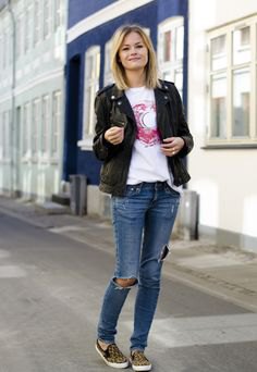 black jeans blazer with ripped blue jeans and canvas shoes with animal print