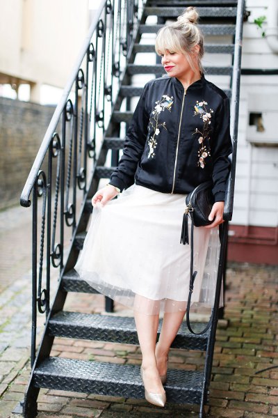 black embroidered bomber jacket, white chiffon flared skirt