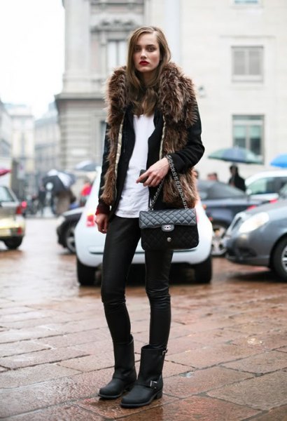 black faux fur coat with leather pants and matt motor boots