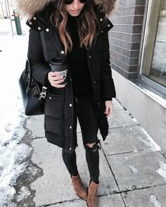 long parka jacket made of black faux fur hood with torn skinny jeans