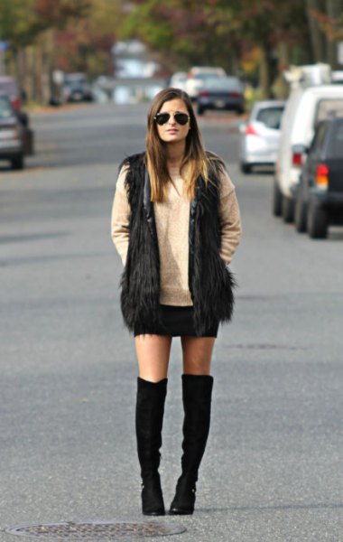 black faux fur vest knee-high boots