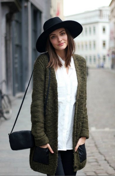 black felt hat with a long gray knitted sweater cardigan