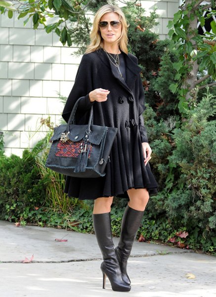 black, flared, knee-length wool coat dress with leather boots
