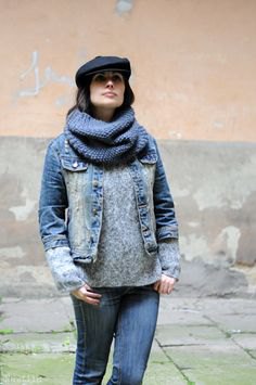 black denim jacket with flat cap and gray sweater