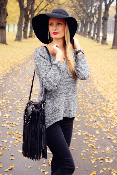 black floppy hat, mottled gray knitted sweater