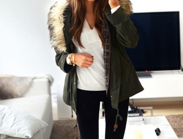 Black fur hooded jacket with white V-neck t-shirt and skinny jeans
