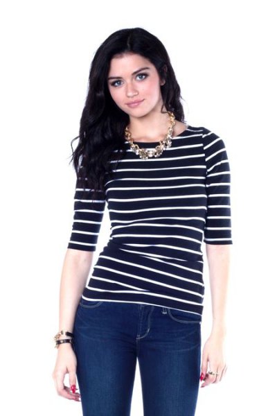 black striped boat neck top with half sleeves and dark blue skinny jeans