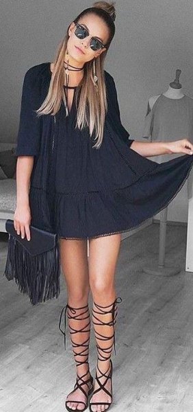 black tunic dress with half sleeves and gladiator sandals