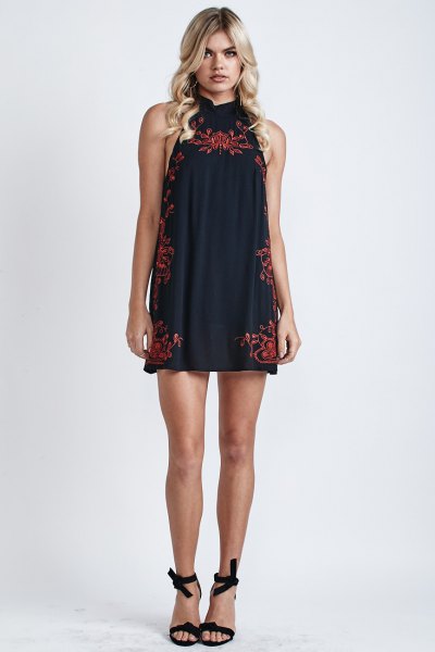black halter neck mini dress with red embroidery