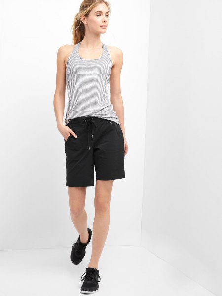 black hiking shorts with a striped vest top