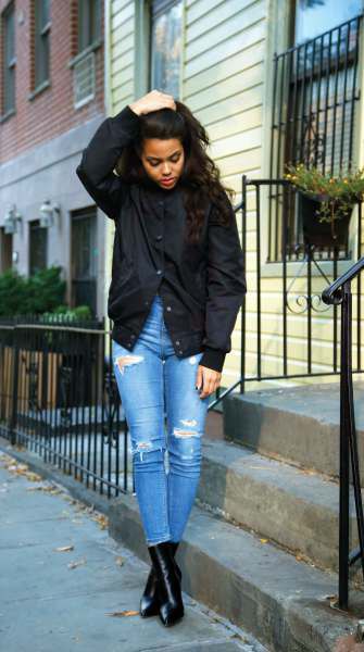 black jacket with blue skinny jeans and leather ankle boots
