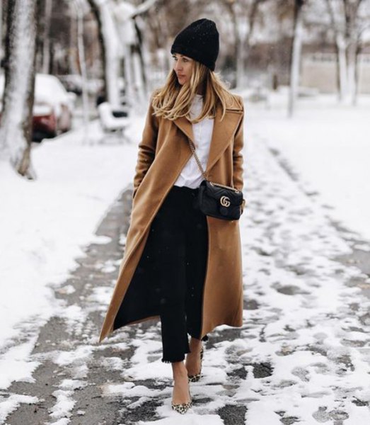 black knitted hat with camel maxi wool coat and short jeans