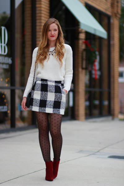 black knitted sweater and black patterned stockings